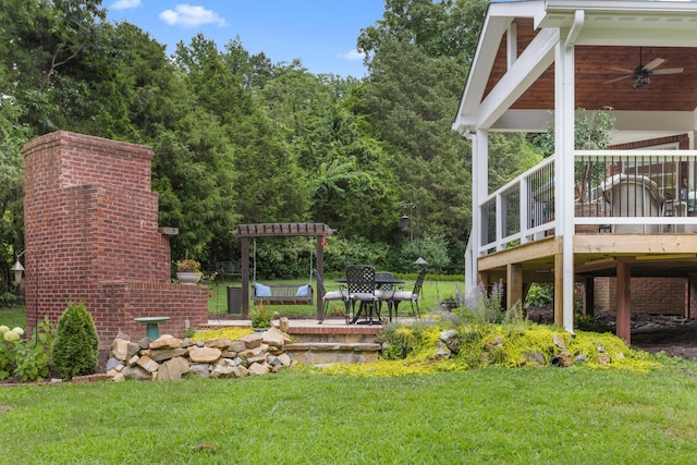 4101 Finch Ln, Chattanooga, TN 37419 - view of green lawn with ceiling fan, a deck, and a patio area