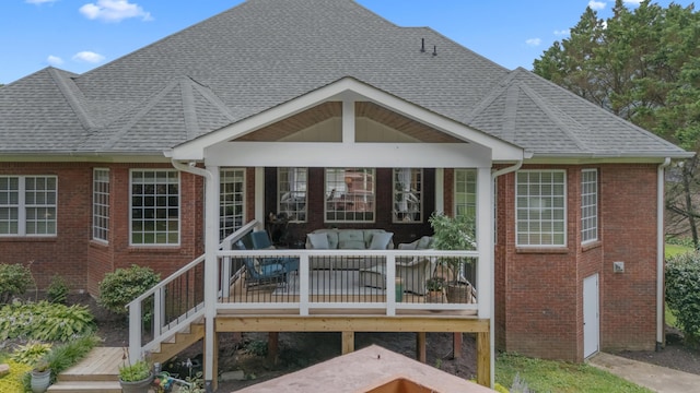 4101 Finch Ln, Chattanooga, TN 37419 - back of property with brick siding, a wooden deck, outdoor lounge area, and roof with shingles