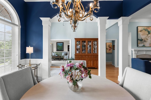 4101 Finch Ln, Chattanooga, TN 37419 - dining area with a chandelier, crown molding, decorative columns, and plenty of natural light