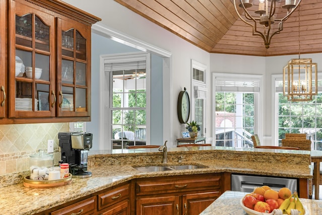 4101 Finch Ln, Chattanooga, TN 37419 - kitchen with a chandelier, brown cabinets, light stone countertops, wooden ceiling, and lofted ceiling