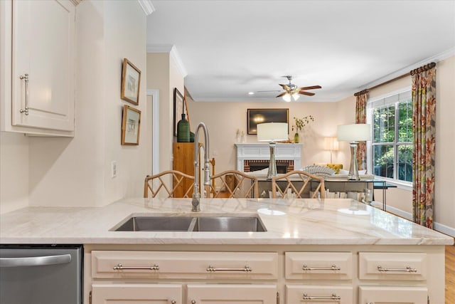 1003 Woodfern Trl, Hixson, TN 37343 - kitchen featuring stainless steel dishwasher, ceiling fan, ornamental molding, light stone countertops, and a fireplace