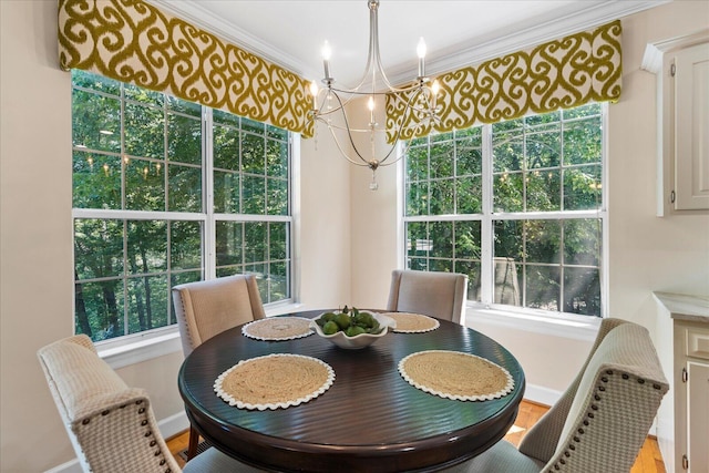 1003 Woodfern Trl, Hixson, TN 37343 - dining room with a chandelier, ornamental molding, healthy amount of natural light, and wood finished floors