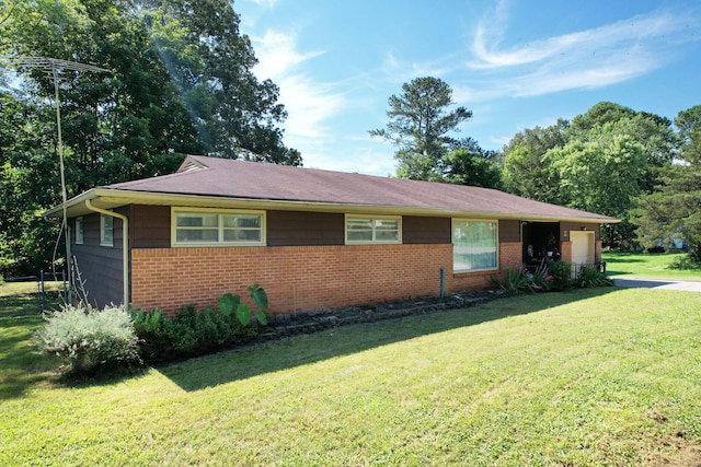 1729 Westland Dr SW, Cleveland, TN 37311 - ranch-style home featuring a front yard, brick siding, and an attached garage