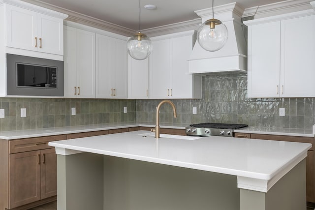 7853 Lemonade St, Chattanooga, TN 37421 - kitchen with stainless steel microwave, light countertops, premium range hood, and backsplash