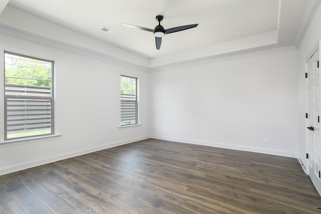 7853 Lemonade St, Chattanooga, TN 37421 - empty room featuring dark wood finished floors, a ceiling fan, and a tray ceiling