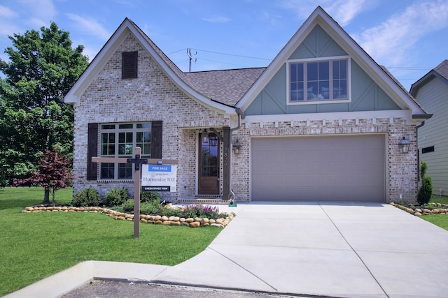 7829 Lemonade St, Chattanooga, TN 37421 - view of front of property with brick siding, a front yard, concrete driveway, roof with shingles, and an attached garage