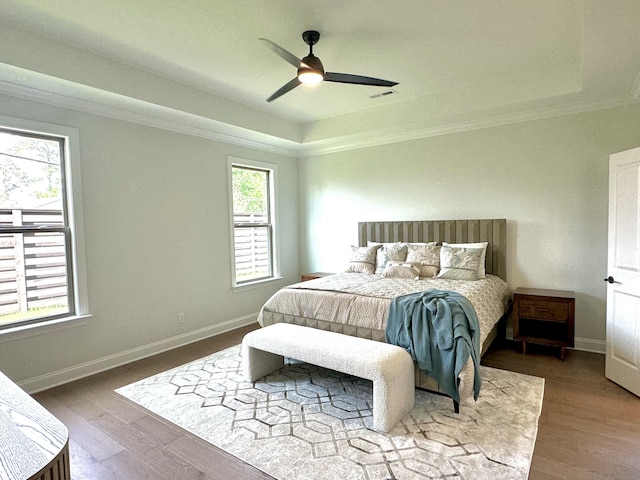 7829 Lemonade St, Chattanooga, TN 37421 - bedroom featuring a tray ceiling, ornamental molding, wood finished floors, and a ceiling fan