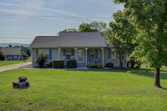 11080 US-11, Trenton, GA 30752 - cape cod-style house with covered porch, a front yard, an outdoor fire pit, and roof with shingles