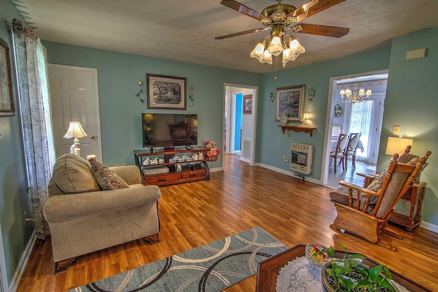 11080 US-11, Trenton, GA 30752 - living room with heating unit, wood finished floors, ceiling fan, and a chandelier