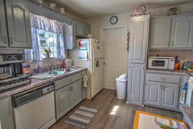11080 US-11, Trenton, GA 30752 - kitchen featuring white appliances, light wood finished floors, a textured ceiling, and light countertops
