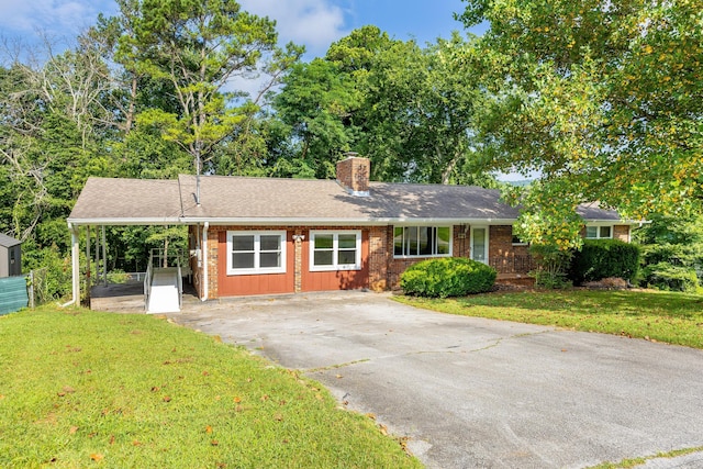 5229 Loblolly Ln, Ooltewah, TN 37363 - ranch-style home with concrete driveway, a chimney, brick siding, and roof with shingles