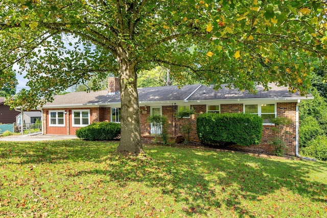 5229 Loblolly Ln, Ooltewah, TN 37363 - ranch-style home with a front lawn, brick siding, and a chimney