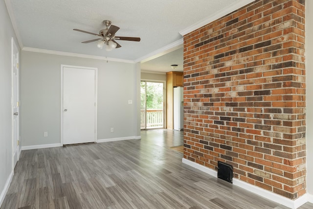 5229 Loblolly Ln, Ooltewah, TN 37363 - unfurnished room featuring ceiling fan, wood finished floors, crown molding, and a textured ceiling