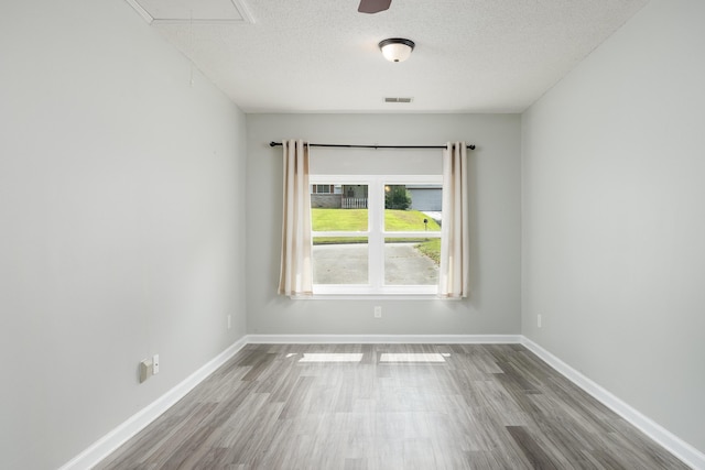 5229 Loblolly Ln, Ooltewah, TN 37363 - spare room featuring wood finished floors and a textured ceiling