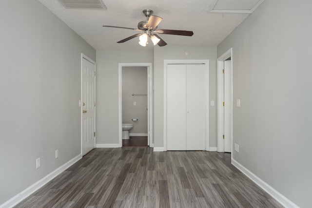 5229 Loblolly Ln, Ooltewah, TN 37363 - unfurnished bedroom with wood finished floors, a textured ceiling, connected bathroom, and ceiling fan