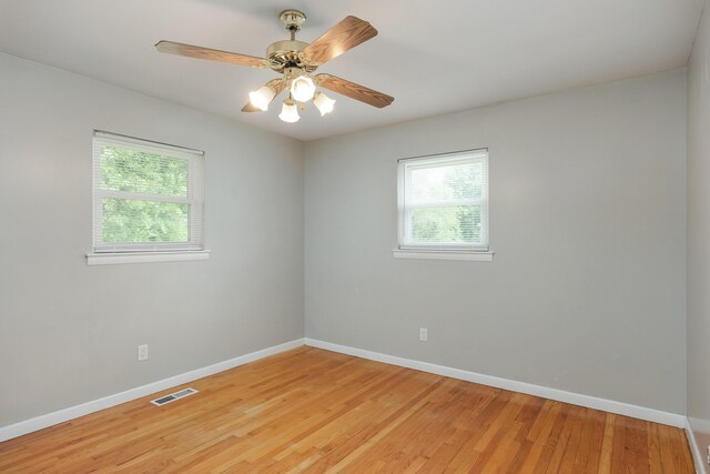 5229 Loblolly Ln, Ooltewah, TN 37363 - empty room with light wood-style floors and a ceiling fan