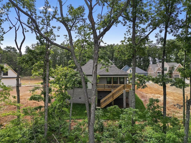 4707 Amethyst Rd Unit 891, Chattanooga, TN 37419 - back of house featuring stairs, a shingled roof, and view of wooded area