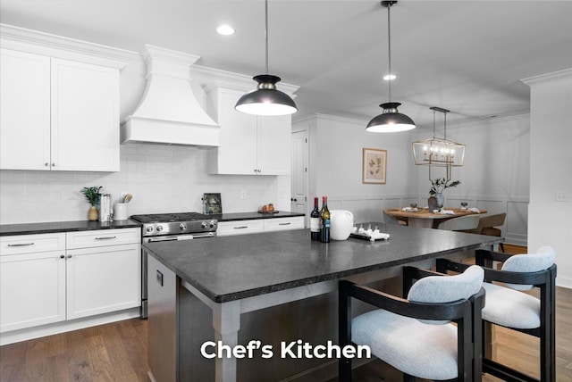 4707 Amethyst Rd Unit 891, Chattanooga, TN 37419 - kitchen featuring custom range hood, dark countertops, white cabinetry, a kitchen breakfast bar, and dark wood-style floors