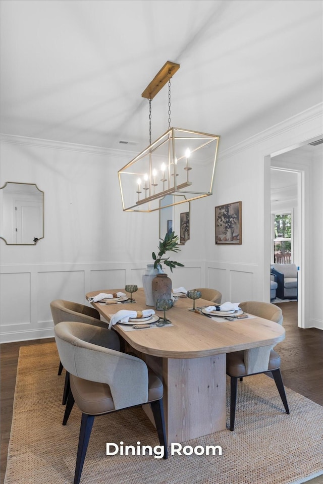 4707 Amethyst Rd Unit 891, Chattanooga, TN 37419 - dining space with crown molding, a decorative wall, a chandelier, dark wood-style floors, and wainscoting
