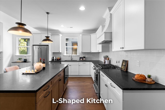 4707 Amethyst Rd Unit 891, Chattanooga, TN 37419 - kitchen featuring stainless steel appliances, dark countertops, white cabinets, a kitchen island, and decorative backsplash