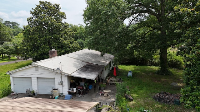 393 Sim Goodwin Rd SW, Mcdonald, TN 37353 - view of property exterior featuring a chimney and a yard