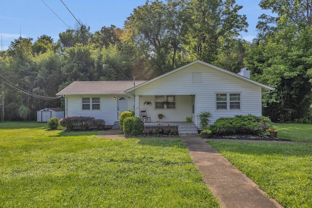 176 Depot St, Soddy Daisy, TN 37379 - bungalow-style house with covered porch, a storage unit, and a front lawn