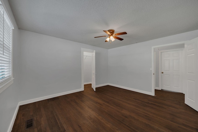 176 Depot St, Soddy Daisy, TN 37379 - empty room featuring a ceiling fan, dark wood-style floors, and a textured ceiling