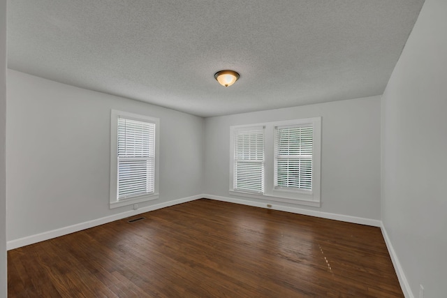176 Depot St, Soddy Daisy, TN 37379 - unfurnished room with dark wood finished floors and a textured ceiling