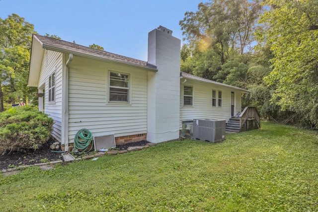 176 Depot St, Soddy Daisy, TN 37379 - back of property with a chimney, a yard, and a shingled roof