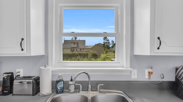4111 Lost Oaks Dr, Ooltewah, TN 37363 - kitchen with white cabinetry and dark countertops