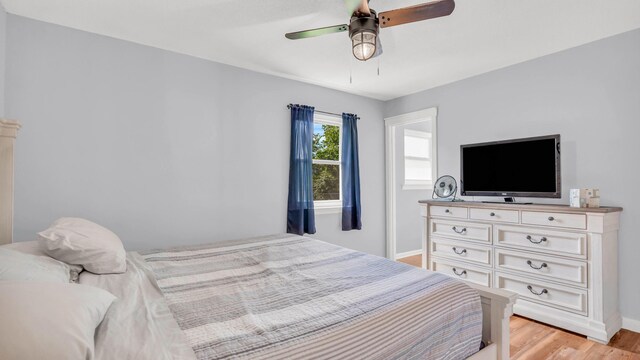 4111 Lost Oaks Dr, Ooltewah, TN 37363 - bedroom featuring light wood-type flooring and ceiling fan