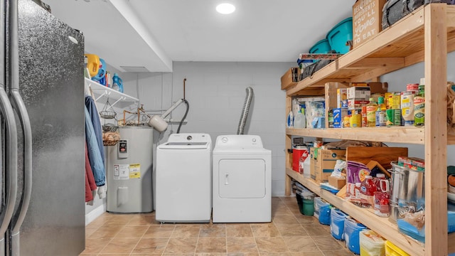 4111 Lost Oaks Dr, Ooltewah, TN 37363 - laundry room featuring water heater, separate washer and dryer, and concrete block wall