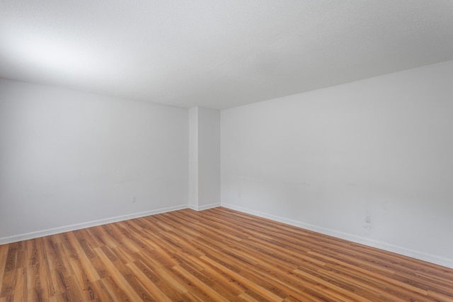8217 Rolling Stone Ln, Ooltewah, TN 37363 - spare room featuring wood finished floors and baseboards