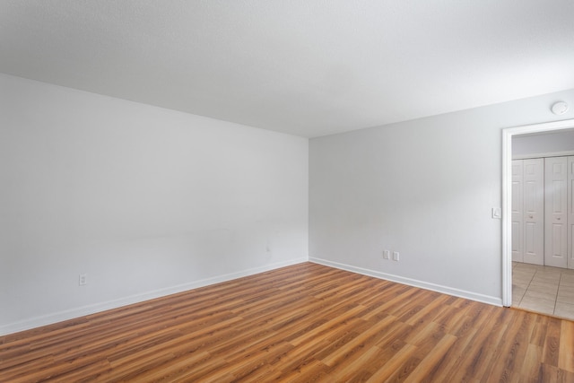 8217 Rolling Stone Ln, Ooltewah, TN 37363 - spare room featuring wood finished floors and baseboards