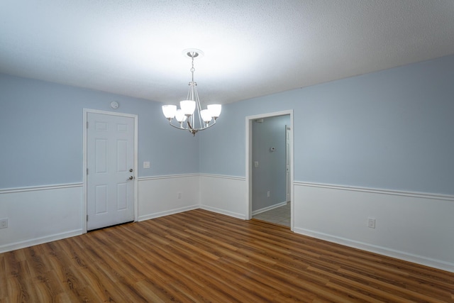 8217 Rolling Stone Ln, Ooltewah, TN 37363 - unfurnished room with wood finished floors and a chandelier