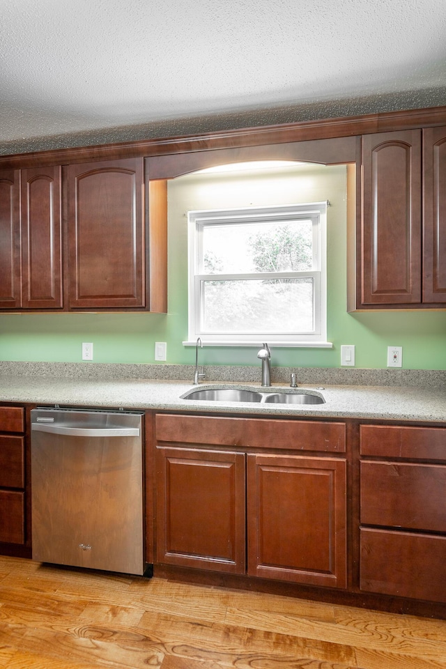8217 Rolling Stone Ln, Ooltewah, TN 37363 - kitchen featuring stainless steel dishwasher, light countertops, and light wood-style flooring