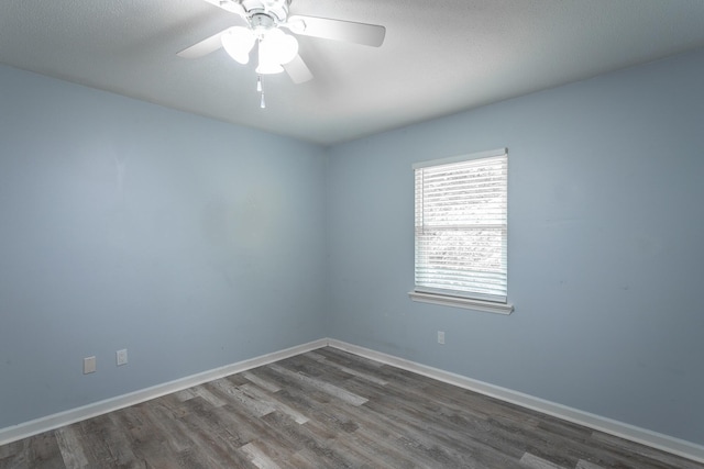 8217 Rolling Stone Ln, Ooltewah, TN 37363 - empty room featuring dark wood-style flooring and ceiling fan