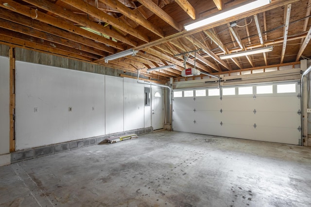 8217 Rolling Stone Ln, Ooltewah, TN 37363 - garage featuring a garage door opener