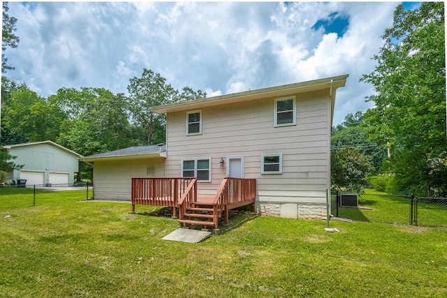8217 Rolling Stone Ln, Ooltewah, TN 37363 - back of house featuring a detached garage, a wooden deck, and a fenced backyard