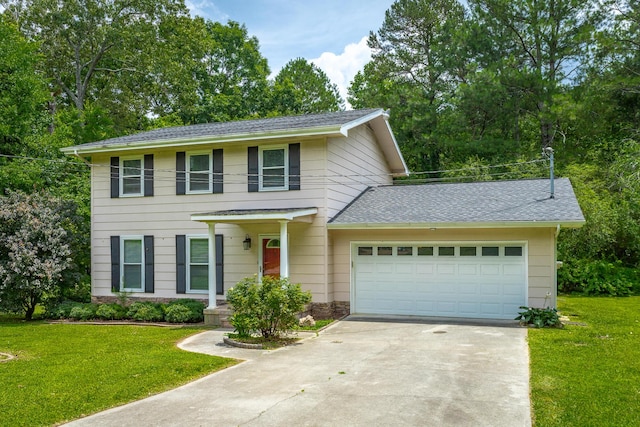 8217 Rolling Stone Ln, Ooltewah, TN 37363 - colonial home with driveway, a front lawn, an attached garage, and a shingled roof