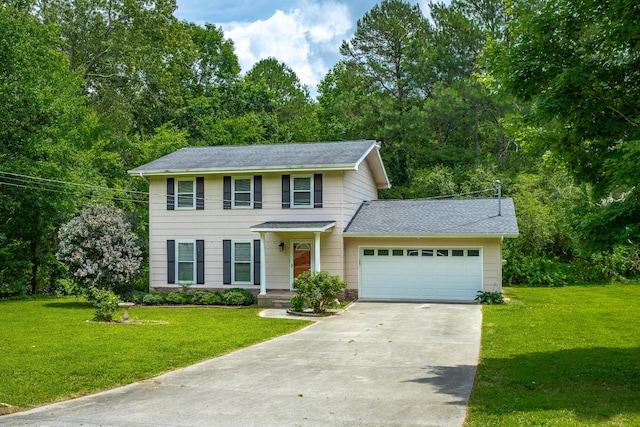 8217 Rolling Stone Ln, Ooltewah, TN 37363 - view of front of house featuring concrete driveway, a garage, a front lawn, and a shingled roof