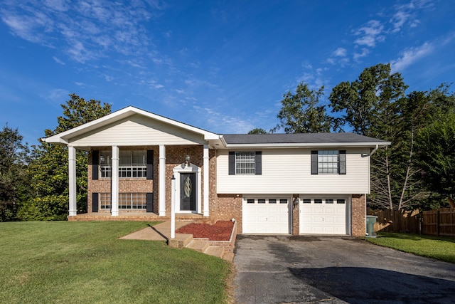 1340 Michael Ln, Hixson, TN 37343 - raised ranch with brick siding, asphalt driveway, and an attached garage