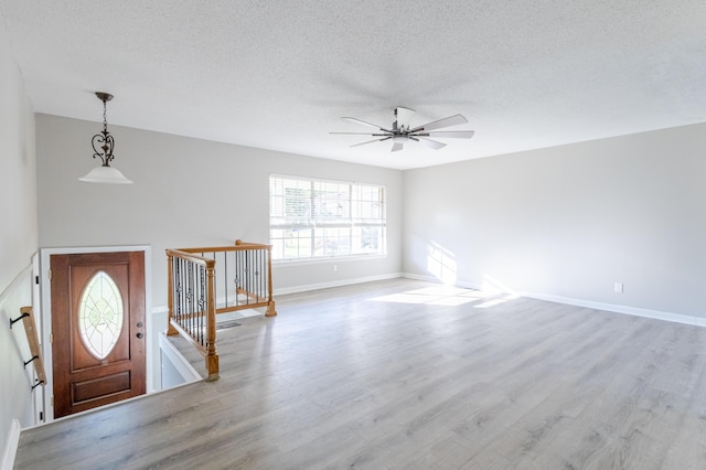 1340 Michael Ln, Hixson, TN 37343 - foyer entrance featuring wood finished floors, a ceiling fan, and a textured ceiling