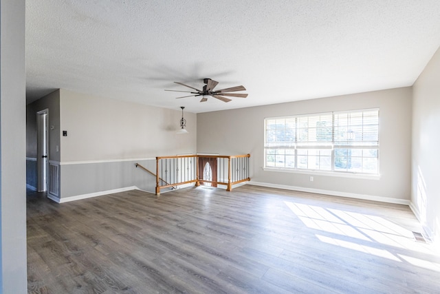1340 Michael Ln, Hixson, TN 37343 - unfurnished room with wood finished floors, ceiling fan, and a textured ceiling