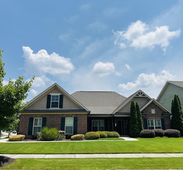 8594 River Birch Loop, Ooltewah, TN 37363 - craftsman-style house with a front yard and brick siding