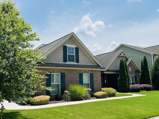 8594 River Birch Loop, Ooltewah, TN 37363 - craftsman-style home featuring a front yard and brick siding