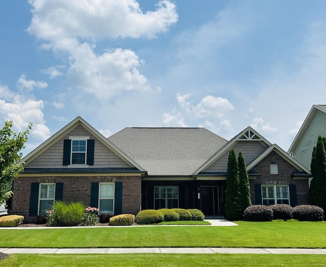 8594 River Birch Loop, Ooltewah, TN 37363 - craftsman-style home with brick siding and a front yard