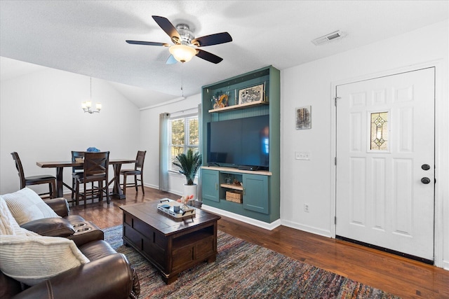 3305 Redding Rd, Chattanooga, TN 37415 - living area with dark wood-style flooring, ceiling fan, a chandelier, and vaulted ceiling