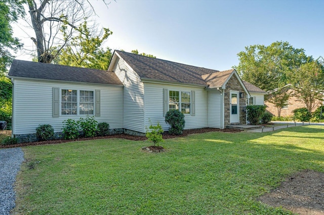 3305 Redding Rd, Chattanooga, TN 37415 - view of front of home featuring a front lawn, roof with shingles, and stone siding