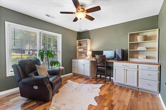 3305 Redding Rd, Chattanooga, TN 37415 - office area featuring ceiling fan, light wood-type flooring, built in desk, and a textured ceiling